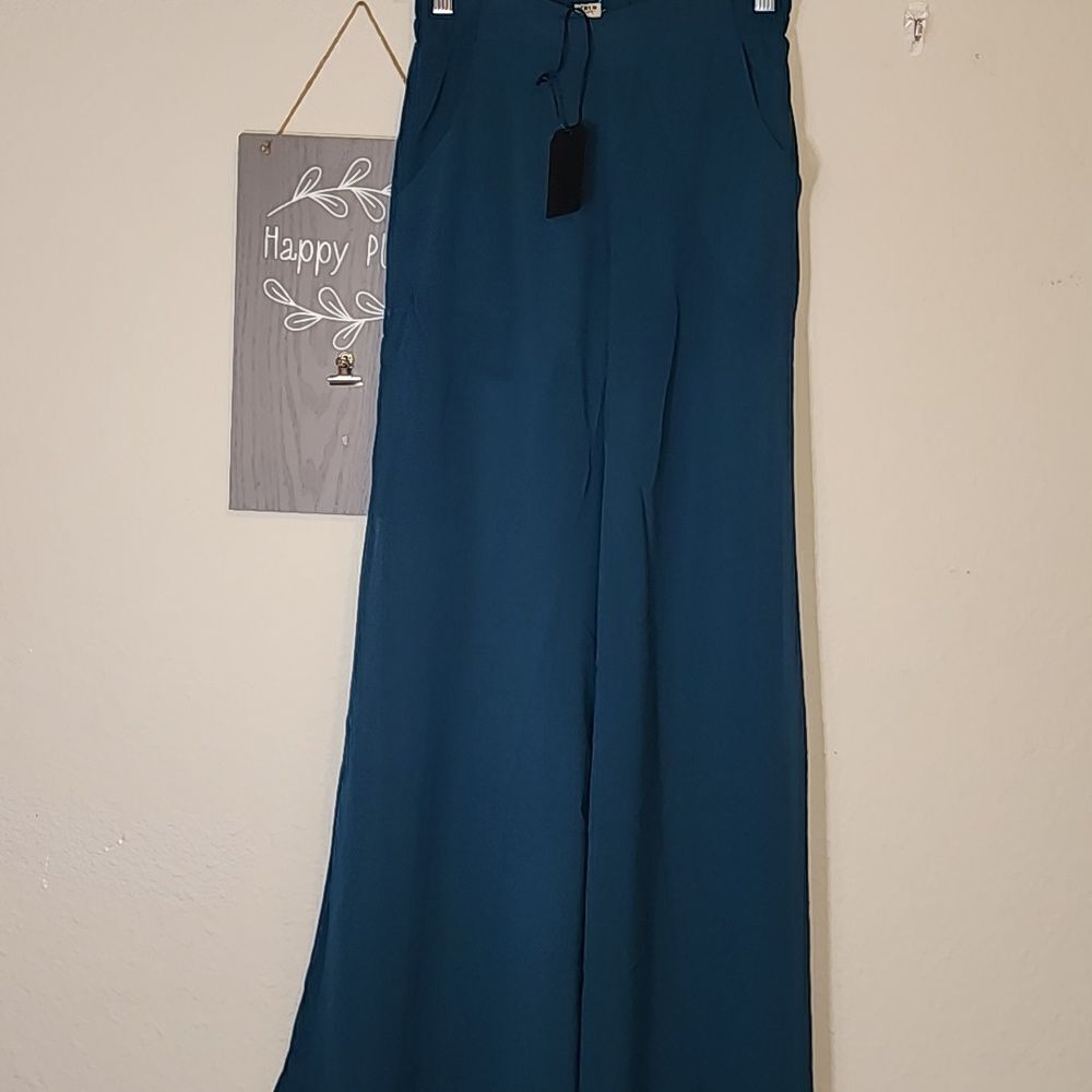 Uniq Green Sheer Pants with Shorts under.